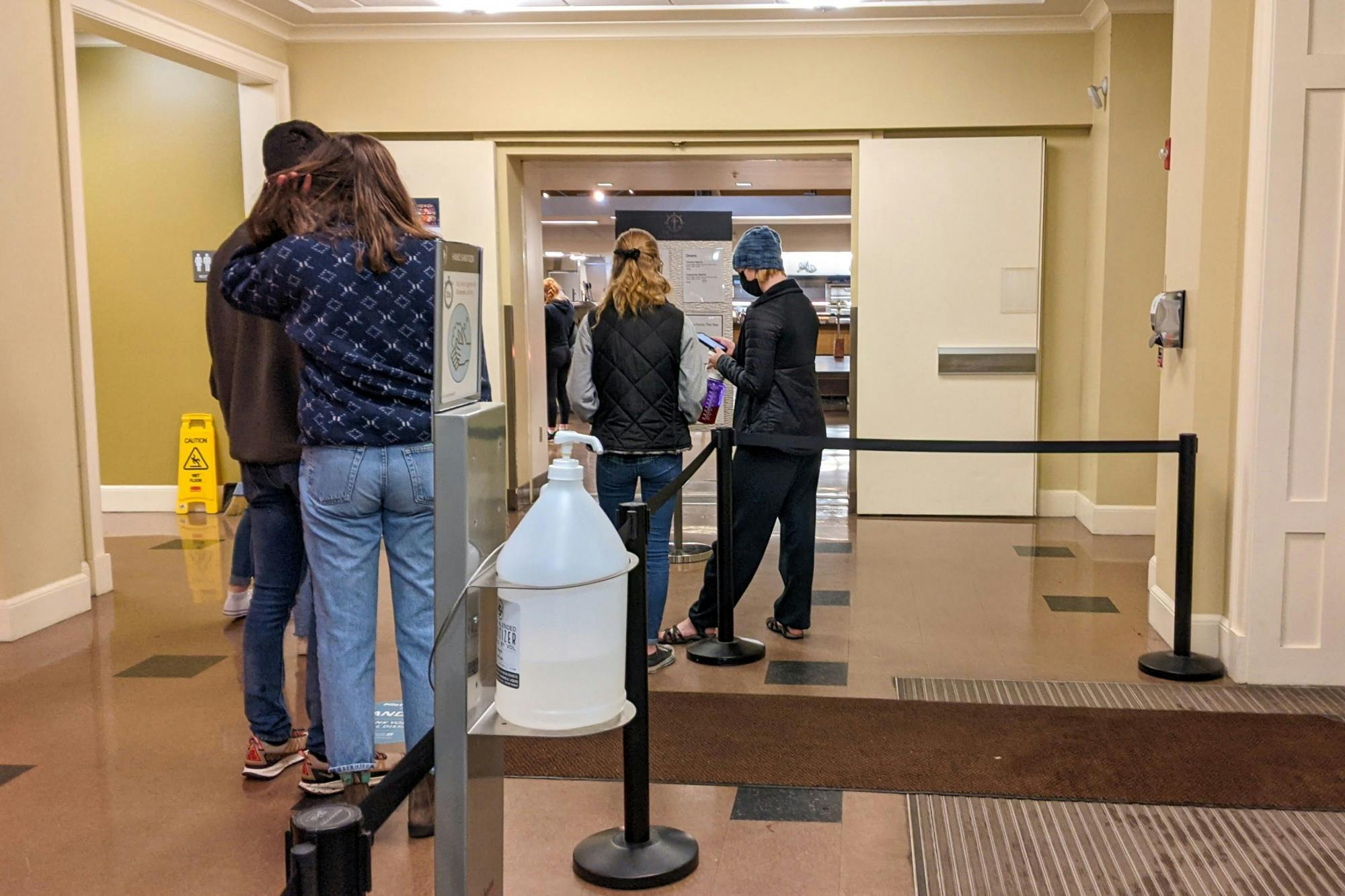 The meal line extends into the quiet side of The Commons, a frequent occurrence during regular meal times.