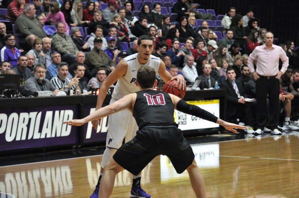  Photo by Kristen Garcia | Bryce Pressley prepares to drive on Santa Clara's Kai Healy. Pressley finished the night with 17 points.