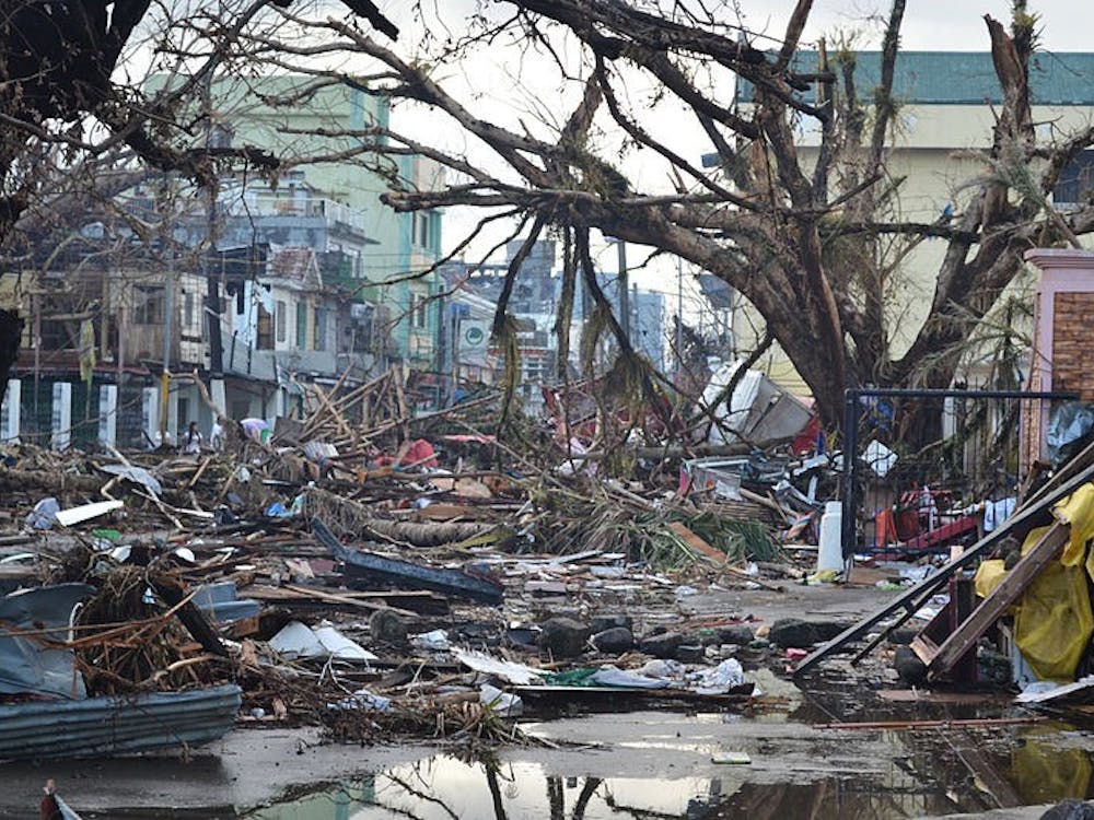 Debris line the streets of the city of Tacloban in the Philippines following the storm. Photo courtesy of Wikimedia Commons.&nbsp;&nbsp;