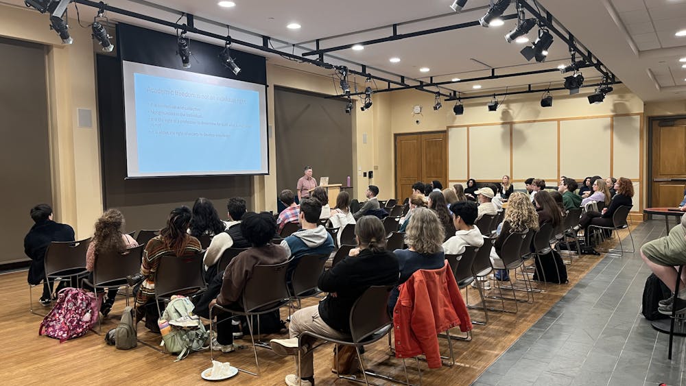 Students and faculty packed the room for the "Universities Under Attack" event.