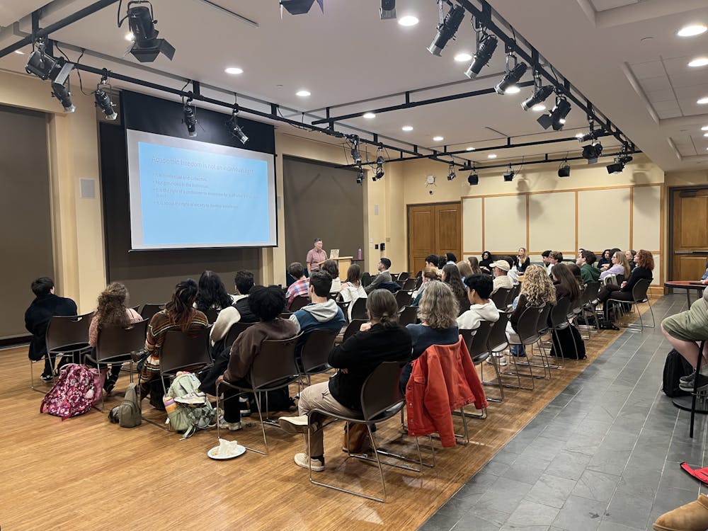 Students and faculty packed the room for the "Universities Under Attack" event.