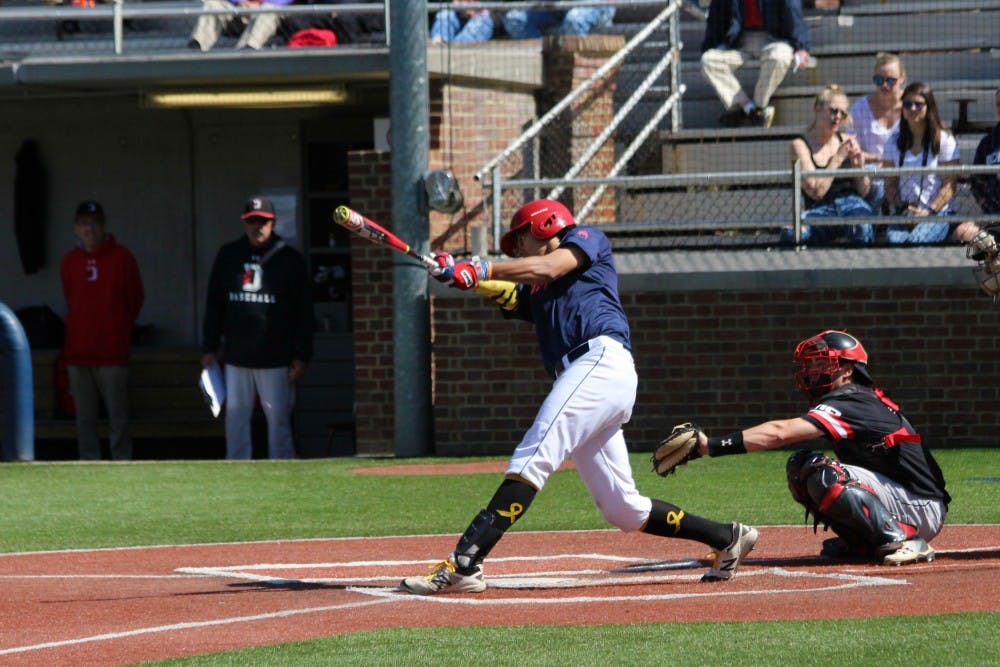 <p>Sophomore Justin Cook&nbsp;hits during a 3-0&nbsp;loss against Davidson.&nbsp;</p>