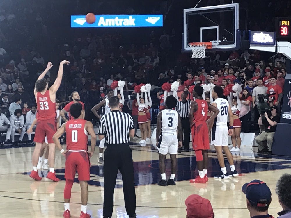 Redshirt sophomore Grant Golden shoots a free throw during the Spiders' home opener game against Longwood in the Robins Center on Thursday, Nov. 9. 
