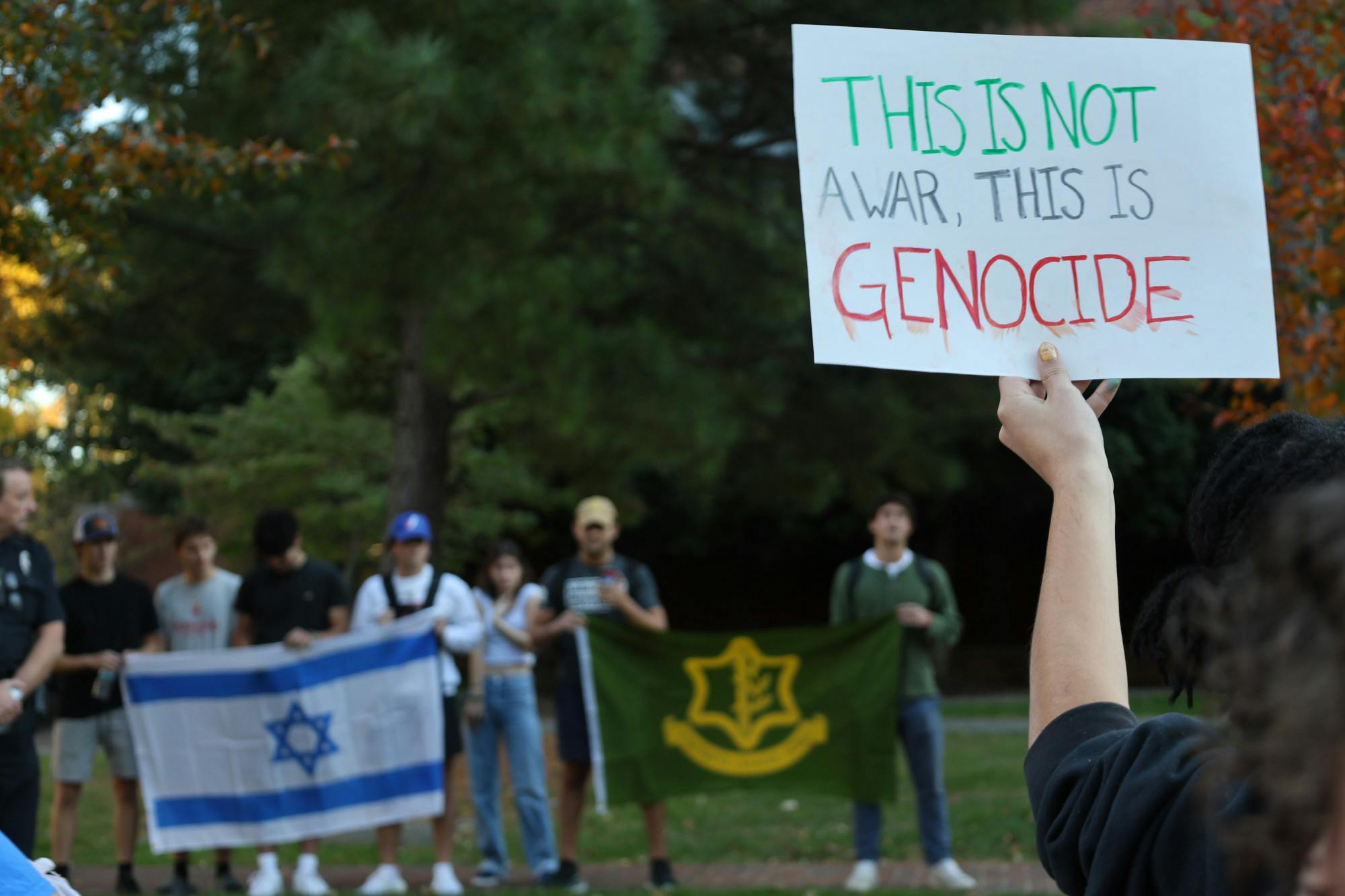 Editors note: Photos from this gallery have been removed to protect the identity of students

Over 100 students and alumni attended Spiders Against Apartheid to mourn the thousands of reported deaths, demand the University of Richmond support Palestinian students and speak out against the actions of the Israeli Defense Forces in Gaza. Midway through the protest, a group of counter-protesters holding an Israeli and Israeli Defense Force flag positioned themselves behind the Spiders Against Apartheid group. The two groups began yelling at each other multiple times throughout the protest, and &nbsp;University of Richmond police officers eventually moved between the two groups.