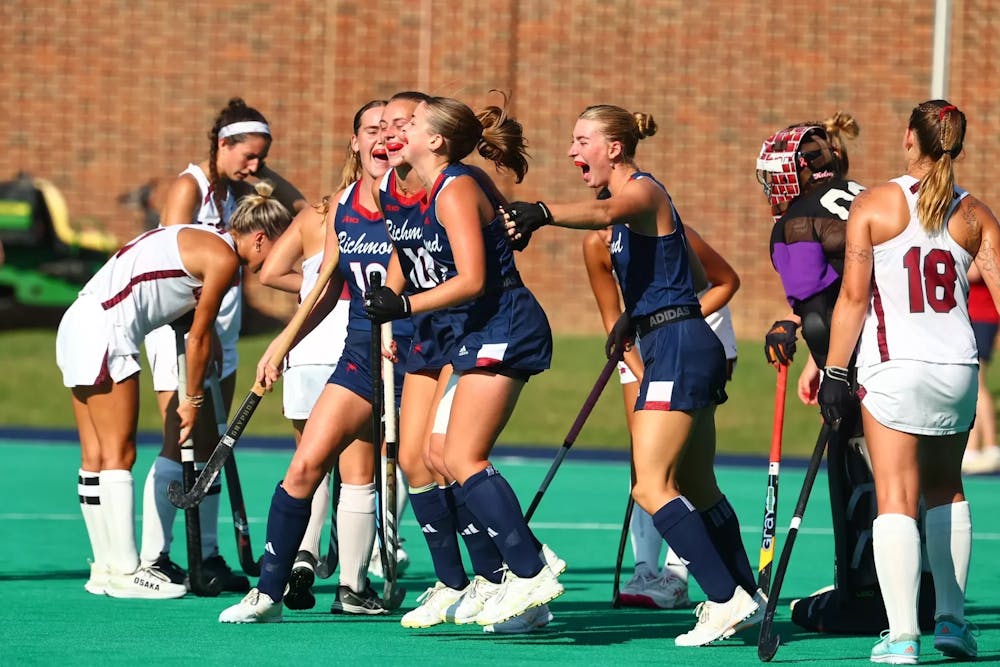 The University of Richmond field hockey team celebrates during its matchup against Lock Haven. Courtesy of Richmond Athletics