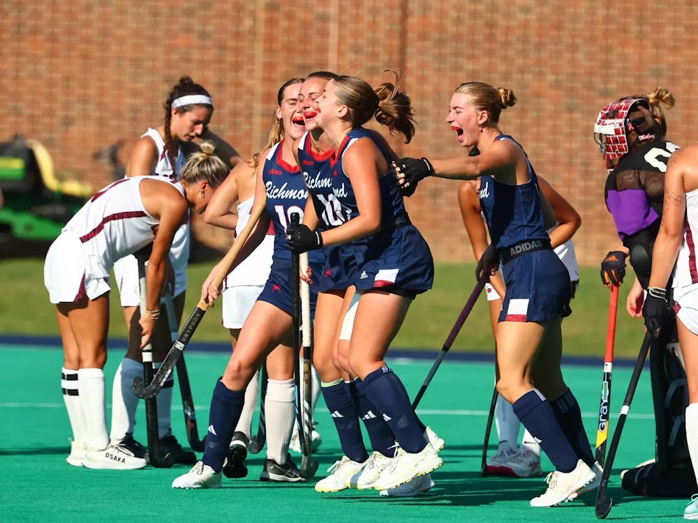 The University of Richmond field hockey team celebrates during its matchup against Lock Haven. Courtesy of Richmond Athletics