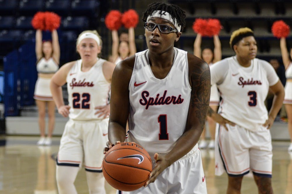 <p>Junior Jaide Hinds-Clarke takes a foul shot in a Spiders victory over UMass Sunday afternoon at the Robins Center. Hinds Clarke finished the night with 15 points and 11 rebounds.</p>
