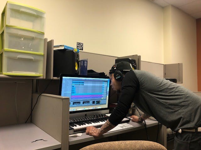 Javier Rogers, a former Richmond city jail inmate, works on a song at the UR Downtown studio. Rogers started making the song while incarcerated.&nbsp;
