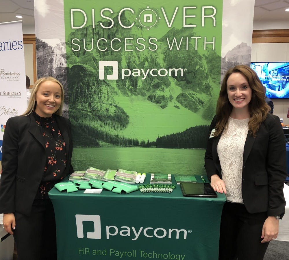 From left, Paige Moynihan and Jill Roberts recruiting at the Spider Career Fair this fall for Paycom. Photo courtesy of Paige Moynihan.