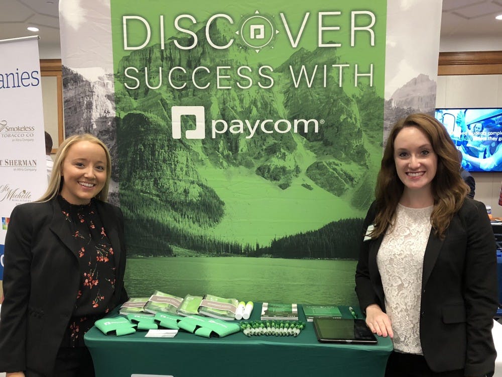 From left, Paige Moynihan and Jill Roberts recruiting at the Spider Career Fair this fall for Paycom. Photo courtesy of Paige Moynihan.