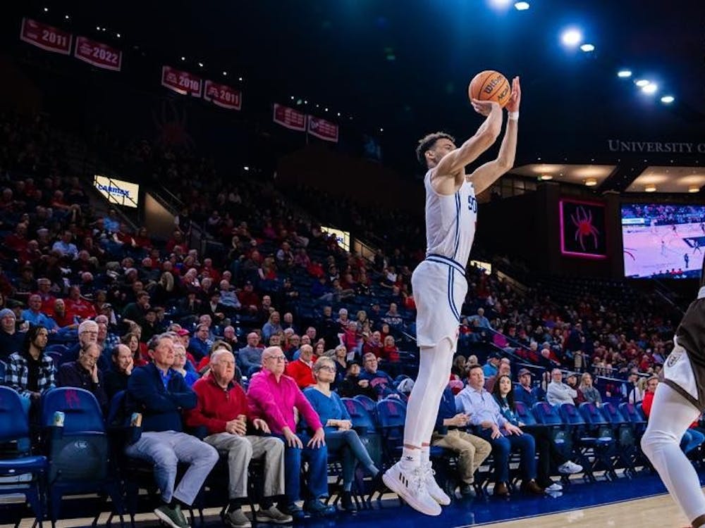 Senior forward Tyler Burton shoots for a shot at the Robins Center on Feb. 1. Photo courtesy of Richmond Athletics. 