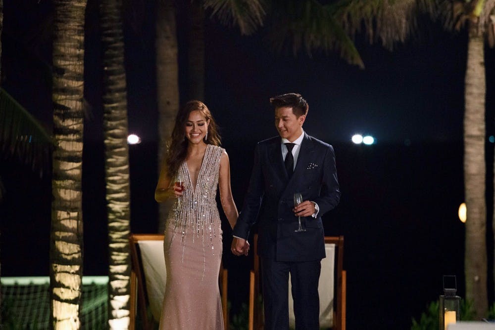 <p>Senior Gwen Nguyen with the Bachelor Vietnam, Jean-Marc Trung Nguyen, during one of the reality TV show's cocktail parties. <em>Photo courtesy of Gwen Nguyen.&nbsp;</em></p>
