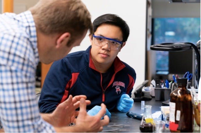 Ryan Coppage (left) and Nathan Dinh (right) in the Gottwald Center for the Sciences researching safe ceramic coatings.&nbsp;