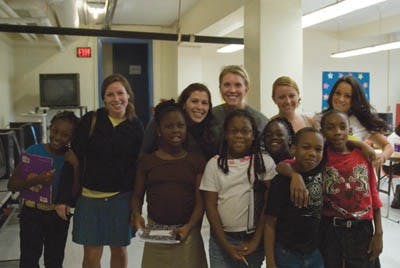 UR students who are part of the Carver promise Mentoring Program on Wednesday Sept 24 around 1pm with their buddies.From left to right:  Brenna Sackman '09, Cheyenne Steuer '09, Sarah Smith '09, Monica Maloney '11, Lauren Venditti '11.