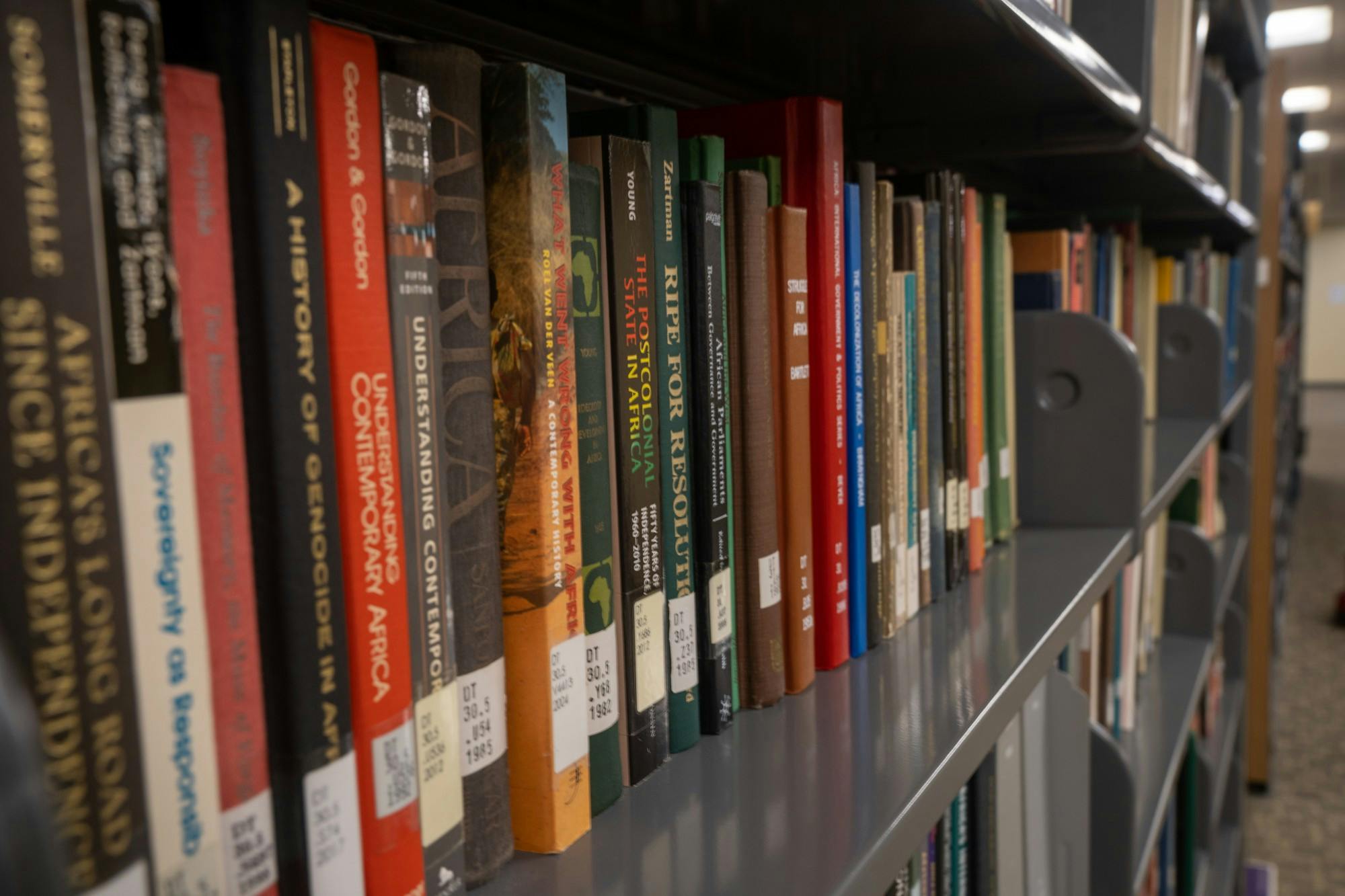 Books on African studies in the stacks of Boatwright Memorial Library.