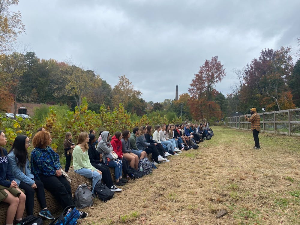 <p>&nbsp;Local food activist Duron Chavis talks to students at the Gambles Mills Eco-corridor on Oct. 26.</p>