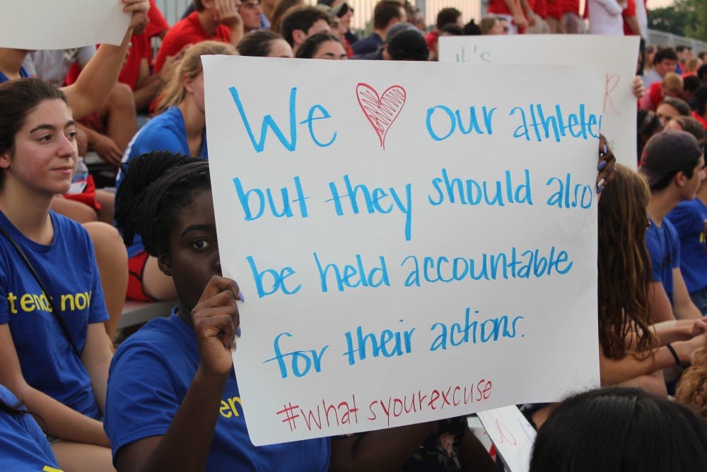 One of the signs&nbsp;in the portion of the&nbsp;student section dressed in "It ends now" shirts.&nbsp;