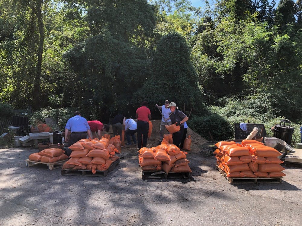Facilities workers fill sandbags in anticipation of flooding on campus from Hurricane Florence. 