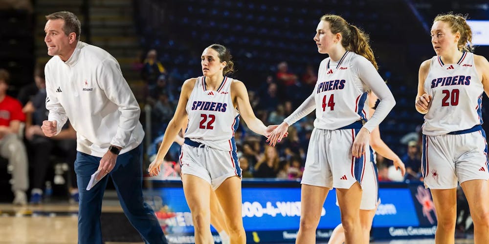 Head Coach Aaron Roussell, Junior guard Rachel Ullstrom, junior forward Maggie Doogan, and graduate forward Addie Budnik. Courtesy of Richmond Athletics