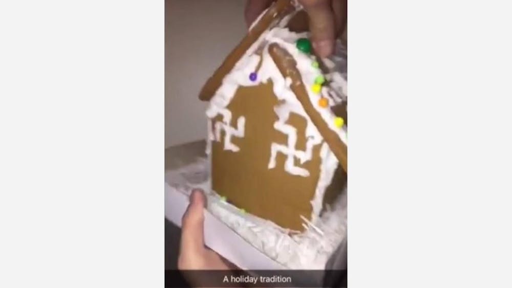<p>A screenshot of the video showing a gingerbread house decorated with swastikas. The video was geotagged to the University of Richmond on Monday night.&nbsp;</p>