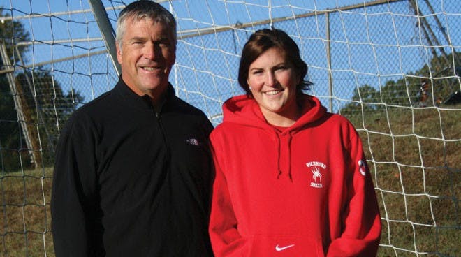 Coach Peter Albright with his daughter, first-year student and member of the varsity women's soccer team Allie Albright.