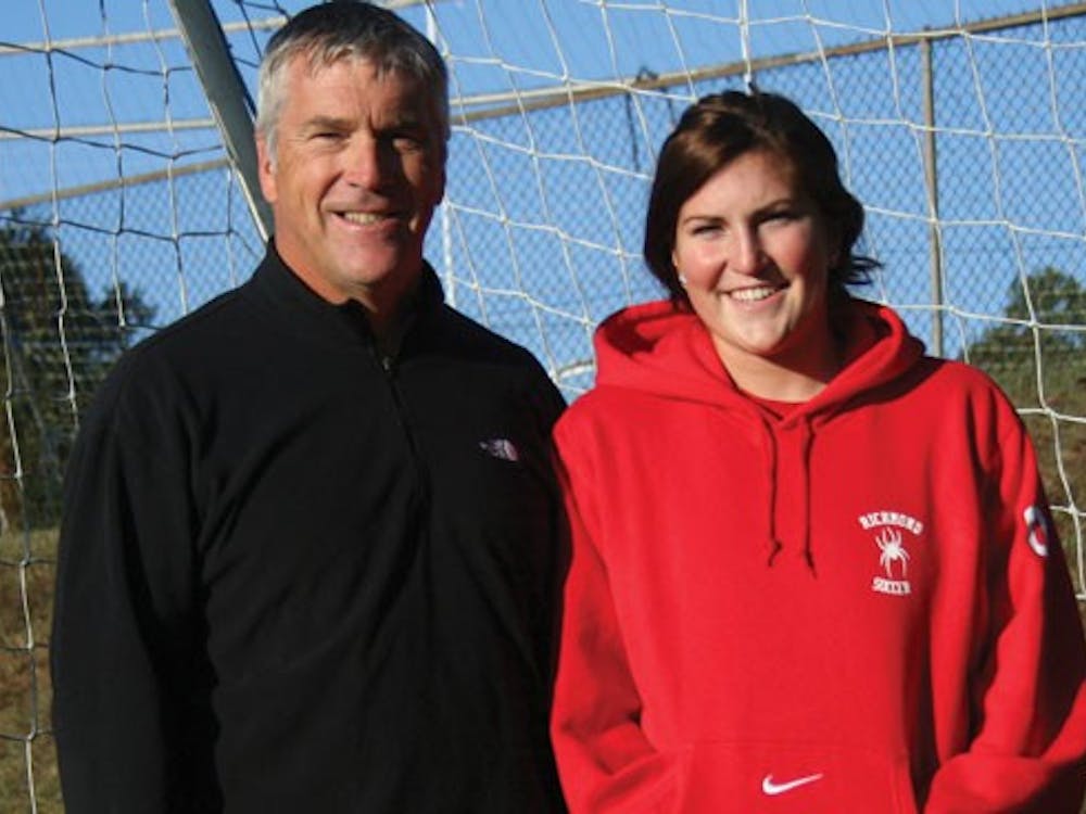 Coach Peter Albright with his daughter, first-year student and member of the varsity women's soccer team Allie Albright.