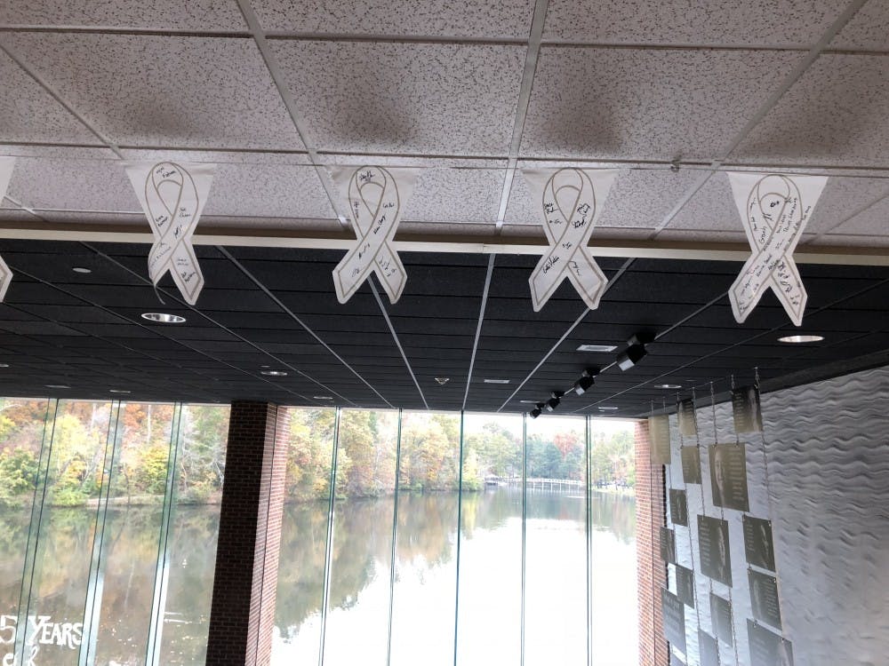 White Ribbons signed by supporters of the campaign hang in the Tyler Haynes Commons.&nbsp;