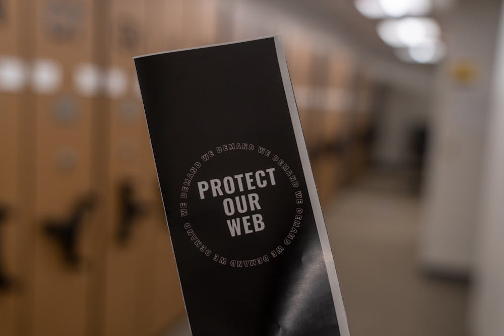 <p>One of the pamphlets outlining the grievances of the Black Student Coalition on a chair at Boatwright Memorial Library on March 7, 2021. &nbsp;&nbsp;</p>