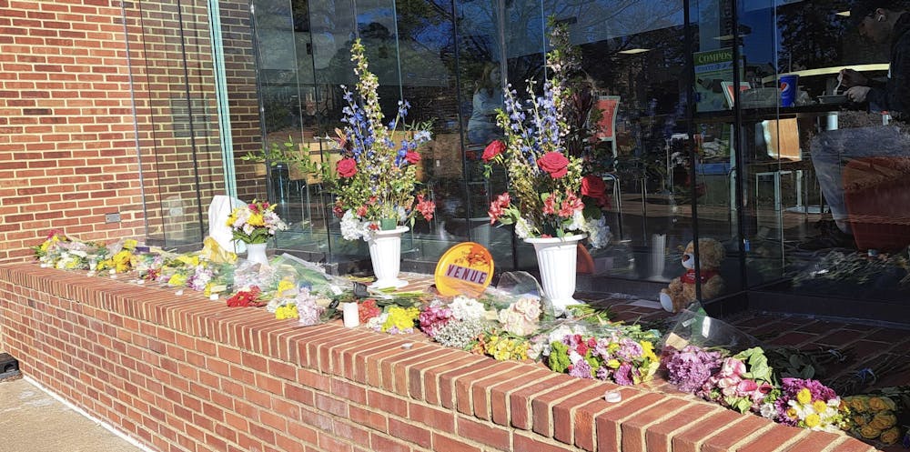 Flowers left outside of Tyler Haynes Commons in honor of Christopher Elvin.