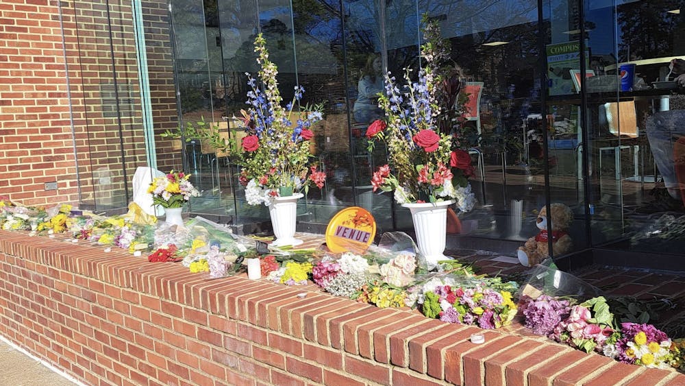 Flowers left outside of Tyler Haynes Commons in honor of Christopher Elvin.