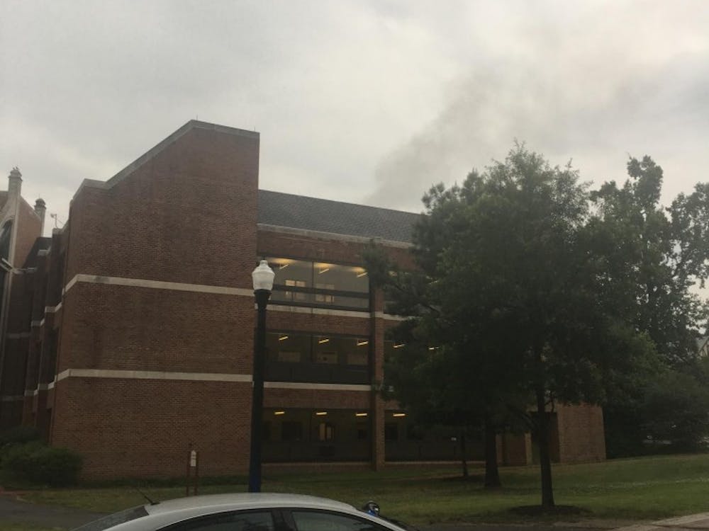 Smoke rising from Gottwald Center for the Sciences on Wednesday evening. A fire broke out on the third floor of the building.&nbsp;