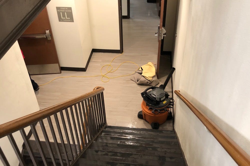<p>A water vacuum sits outside of the flooded room in Jeter Hall.&nbsp;</p>