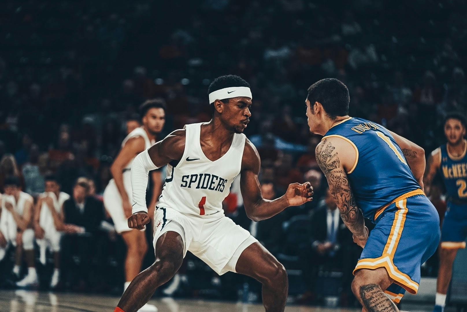Redshirt junior guard Blake Francis defends a McNeese State player as he attempts to drive to the basket.