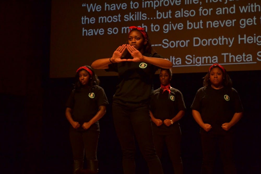Members of National Pan-Hellenic Council perform a stepping routine during Richmond's MLK Day Commemoration Ceremony.