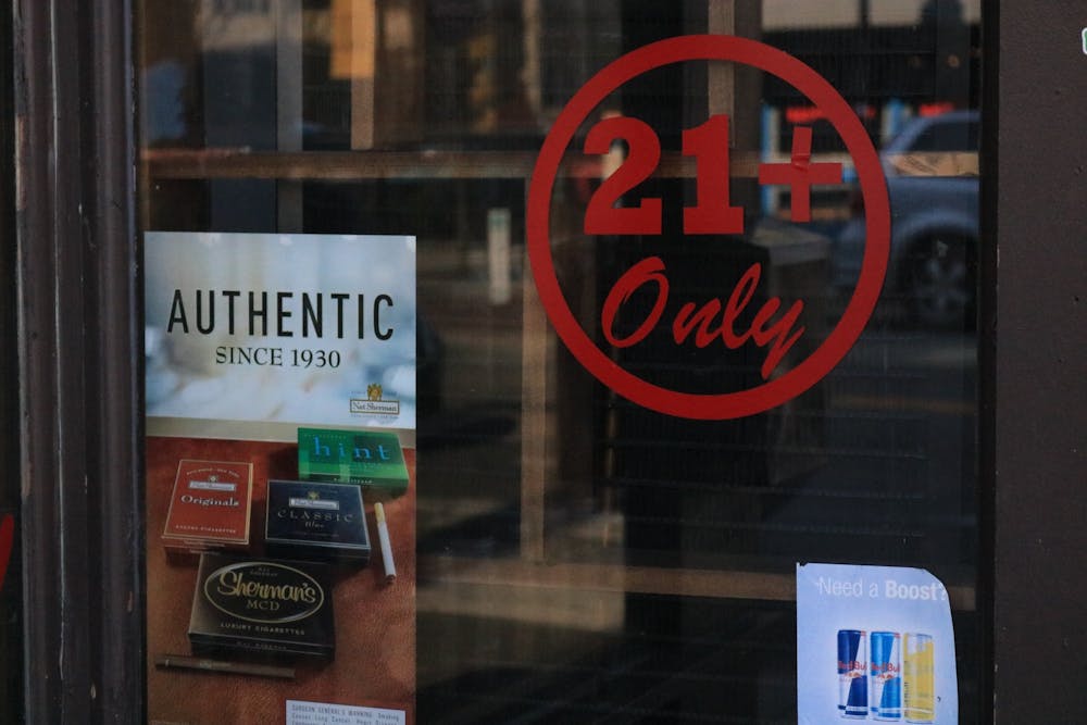<p>21+ sign at a storefront in Richmond.&nbsp;</p>