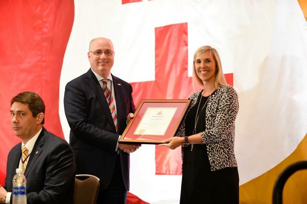 Meg Pevarski, director of Greek life, receiving her award from the national Kappa Alpha Order. Photo courtesy of the national Kappa Alpha Order's Facebook page.