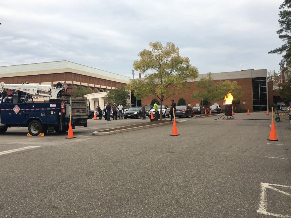 AmeriGas and URPD employees observe a controlled burn of the propane in a leaking tank.
