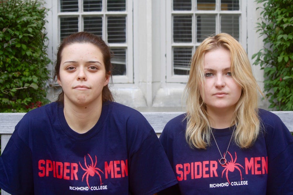 <p>Westhampton College students&nbsp;Cecilia Carreras, left, and Whitney Ralston wear&nbsp;Richmond College t-shirts to reclaim their strength from the college they say wronged them.</p>