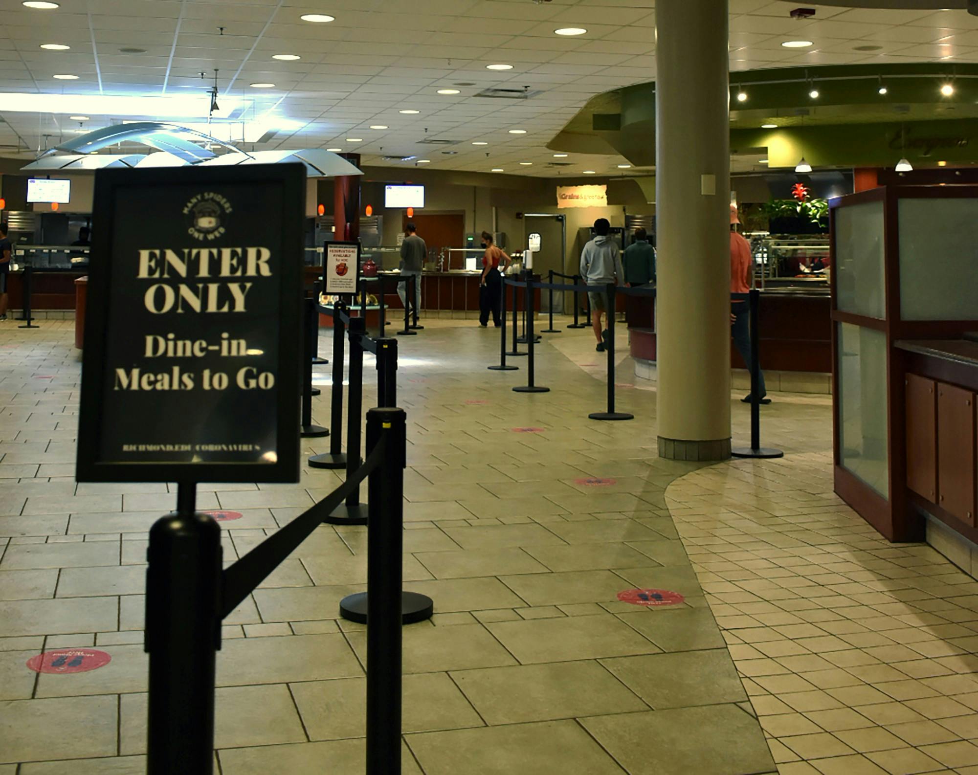 Rope barriers and signs lead diners through the stations at the Heilman Dining Center in a socially distanced manner.&nbsp;