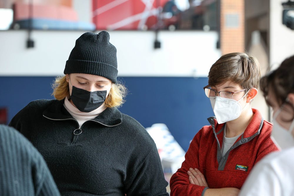 Two students wear masks indoors during the mask Mandate at the University of Richmond.