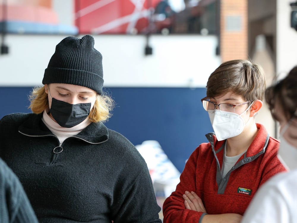 Two students wear masks indoors during the mask Mandate at the University of Richmond.