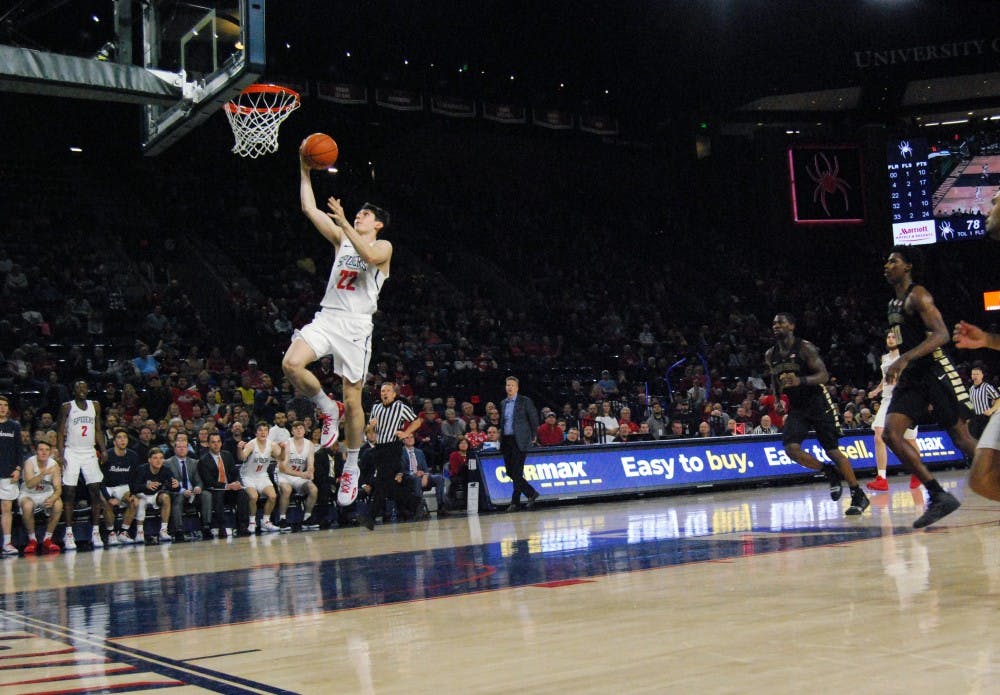 <p>First-year guard Andre Gustavson drives to the basket Saturday, Dec. 1, in a victory over Wake Forest.&nbsp;</p>