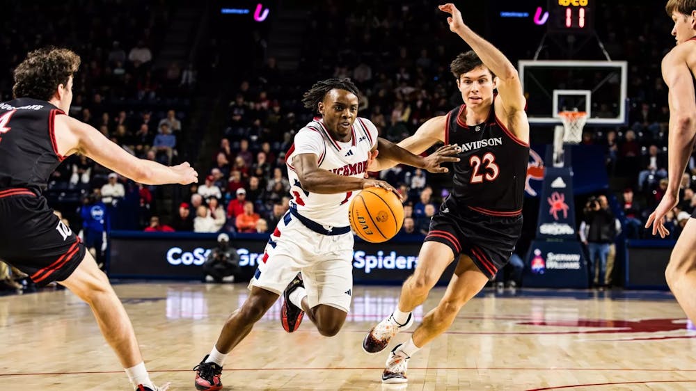 <p>Sophomore Guard Mikkel Tyne dribbles past Davidson player during game January 25. Photo Courtesy of Richmond Athletics.&nbsp;</p>