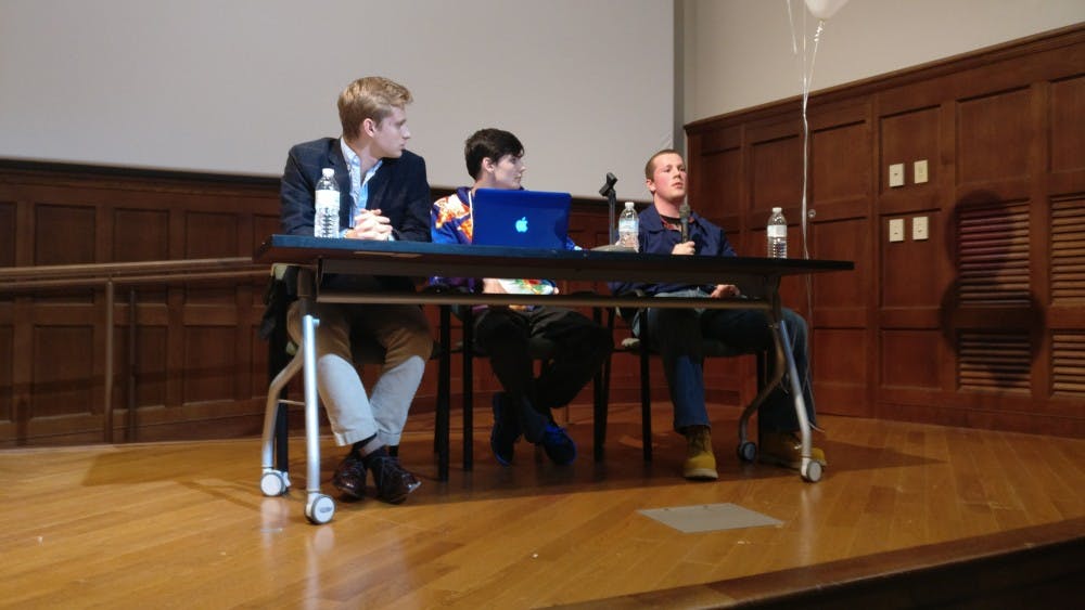 <p>Panelists disagree over the role of government in higher education in Ukrop Auditorium.</p>