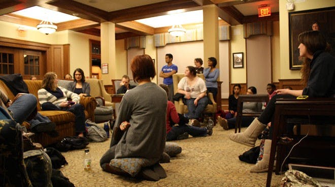 Junior Kara Logan observes T-shirts designed by victims and friends of victims of domestic violence including Richmond faculty, staff and students on display at the Clothesline Project. (IVORI ZVORSKY/THE COLLEGIAN) 