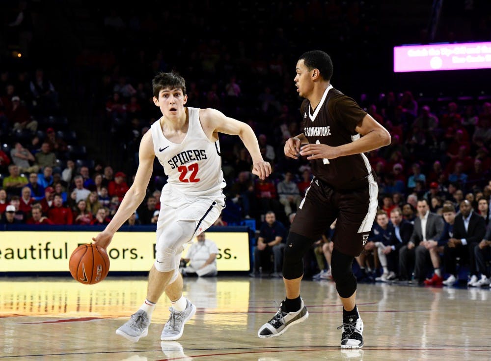 <p>First-year guard Andre Gustavson drives the ball down the court in a losing game against St. Bonaventure on Saturday, Jan. 26.&nbsp;</p>