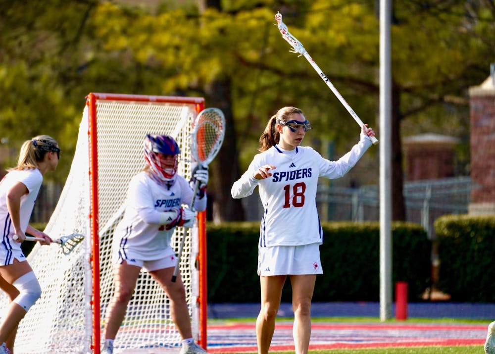 Senior defender Meaghan Trainer, sophomore goalkeeper Abby Francioli and sophomore midfielder Caroline Chandler defending against Navy. 