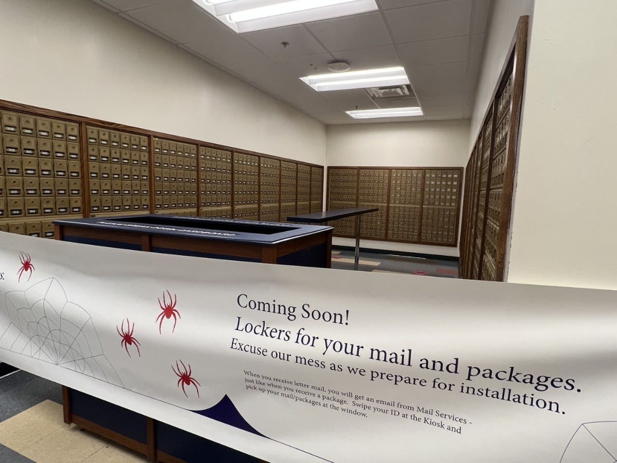 Banner sectioning off area of the UR post office.