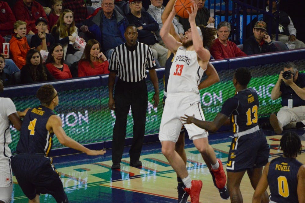 Sophomore forward Grant Golden drives to the basket in a loss against La Salle. Golden finished the night with 12 points and six rebounds.