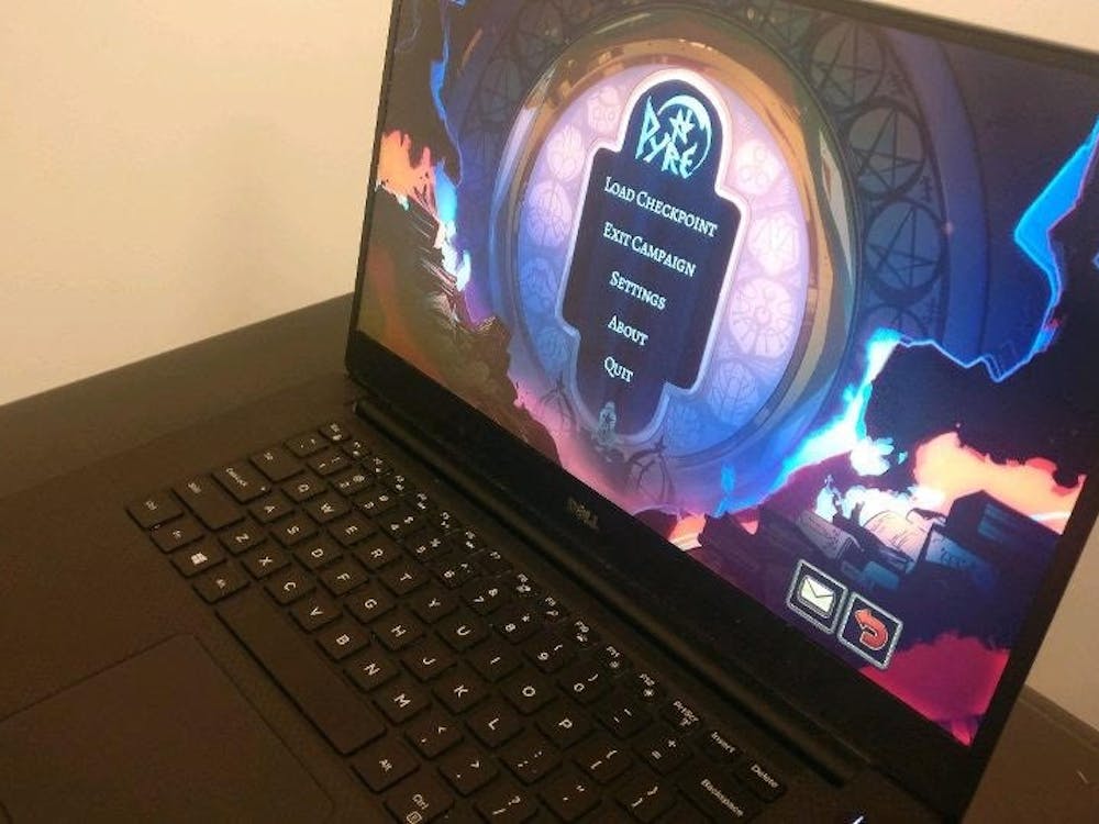 "Pyre," pictured on the computer, is a game developed by SuperGiant, a video game developer known for their art and storytelling components.&nbsp;